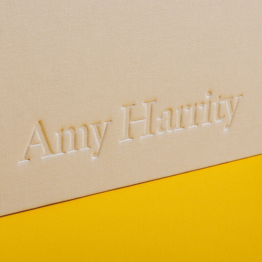 blind embossed logo on the side of white photographers portfolio - Gallery image 3