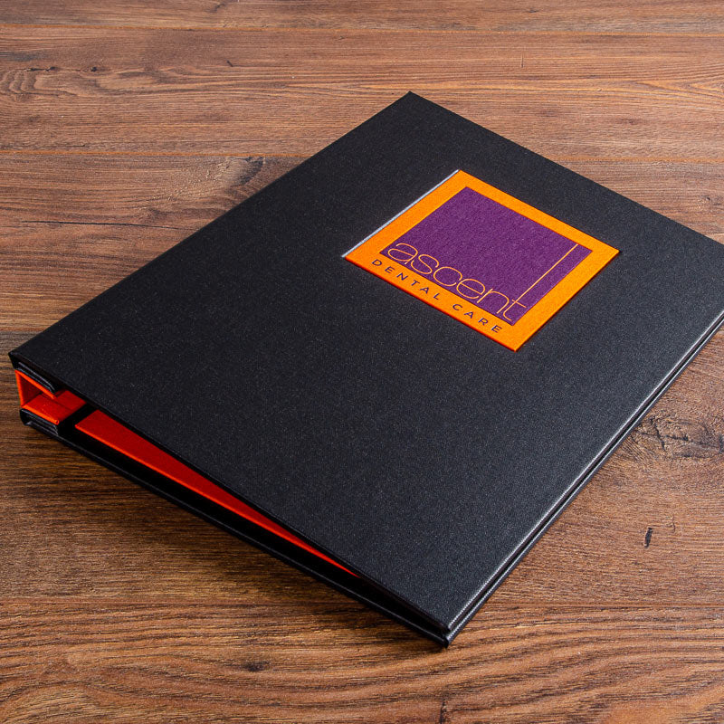 A4 custom made company presentation binder in black fabric with complex personalised logo plaque in orange - Gallery image 3