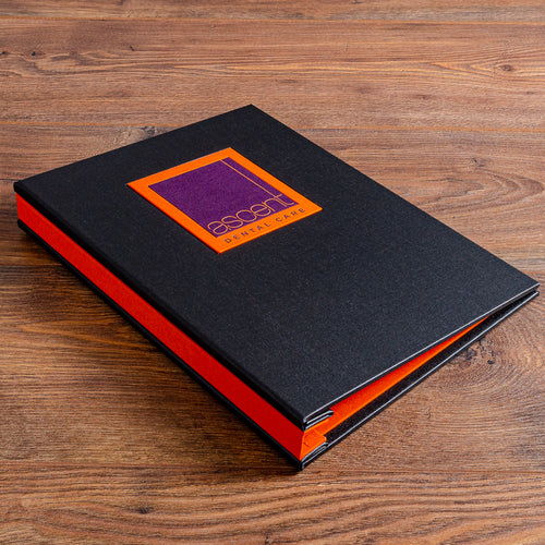 high quality custom made company binder in black and orange fabric in wood back ground