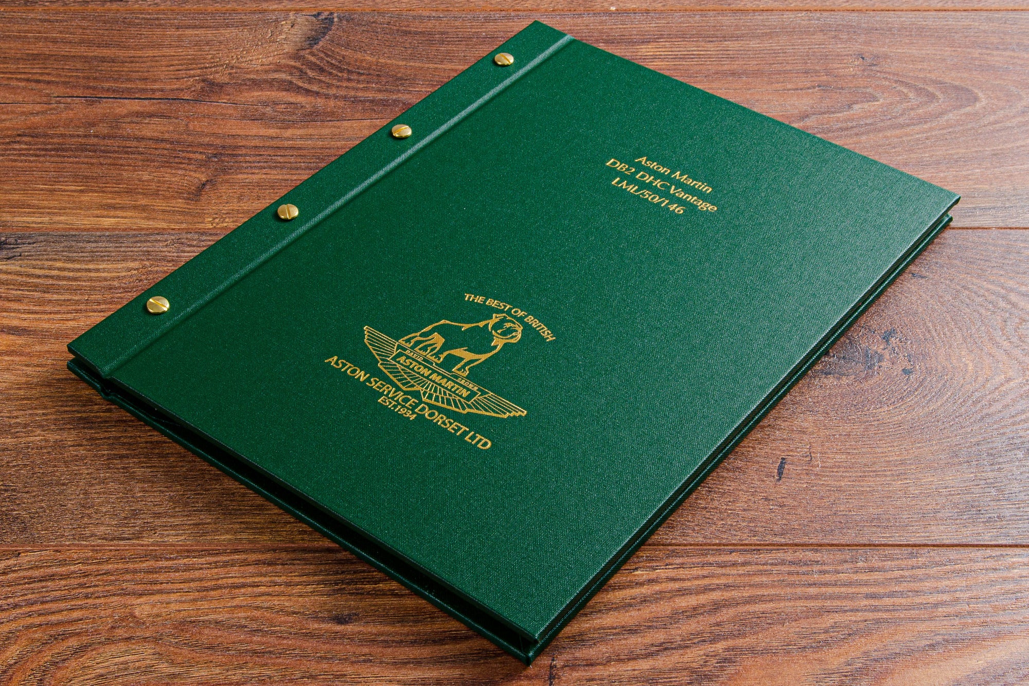 Gold embossed cover on green vehicle document binder