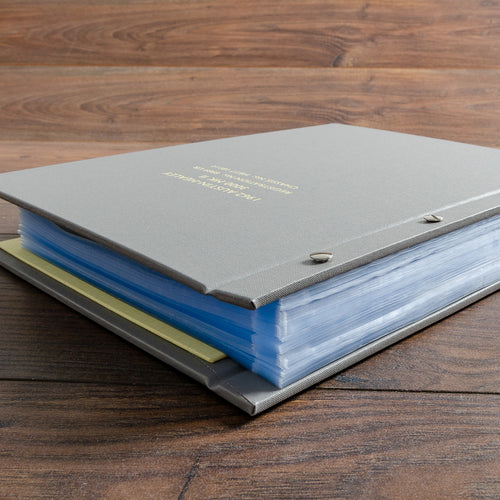 screw post binder with many plastic page protector pockets