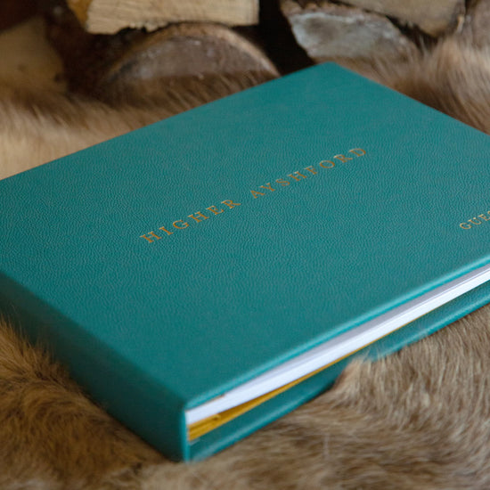 blue luxury leather A4 landscape personalised guest book with personalised cover