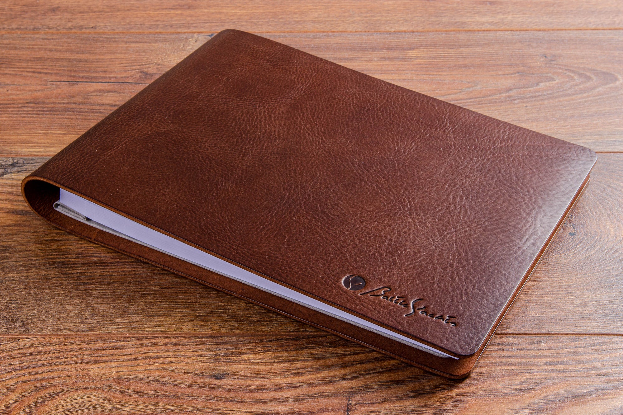 Brown leather hidden screw post binder with detailed embossing