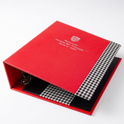 Custom red leather ring for 1st ever porsche 911 in red leather with hounds tooth detailing and silver foil embossing on the cover