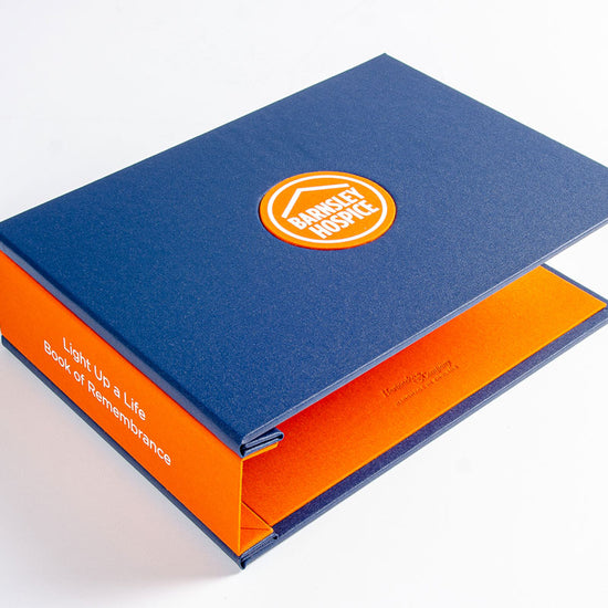 A4 landscape custom made remembrance book with circular stamped personalised logo