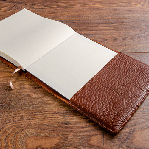 hand stitched leather dust jacket in tumbled veg tanned leather