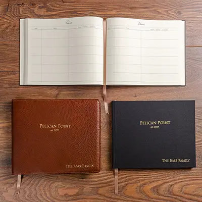 Personalised guest book with gold embossed cover and genuine leather personalised dust jacket.