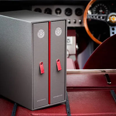 grey box containing two luxury ring binders, also grey but with red tags. the boxes have the E type jaguar badge and the words documents and restoration - Vehicles, Ring Binders, Multi Slipcase, All Ring Binders