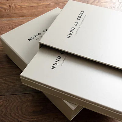 Custom made personalised portfolio book with slipcase and clamshell storage box embossed with black foil