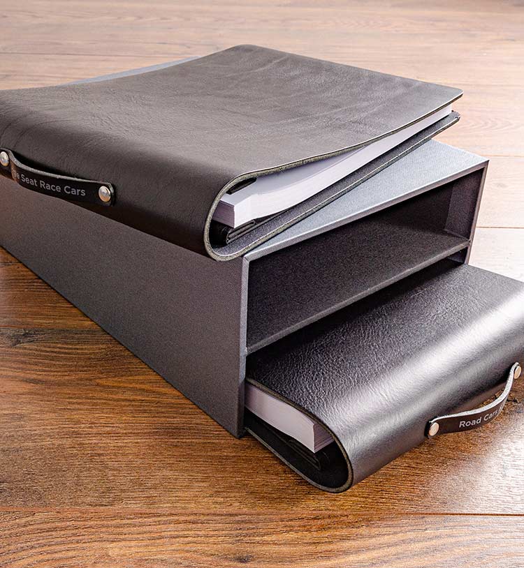 Black leather folders and slipcase for classic car collection