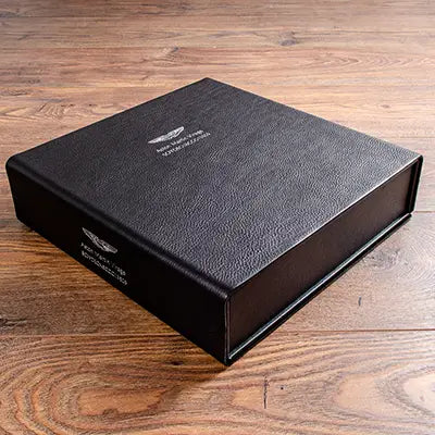Custom leather box file for vehicle documents with silver embossing on cover and spine