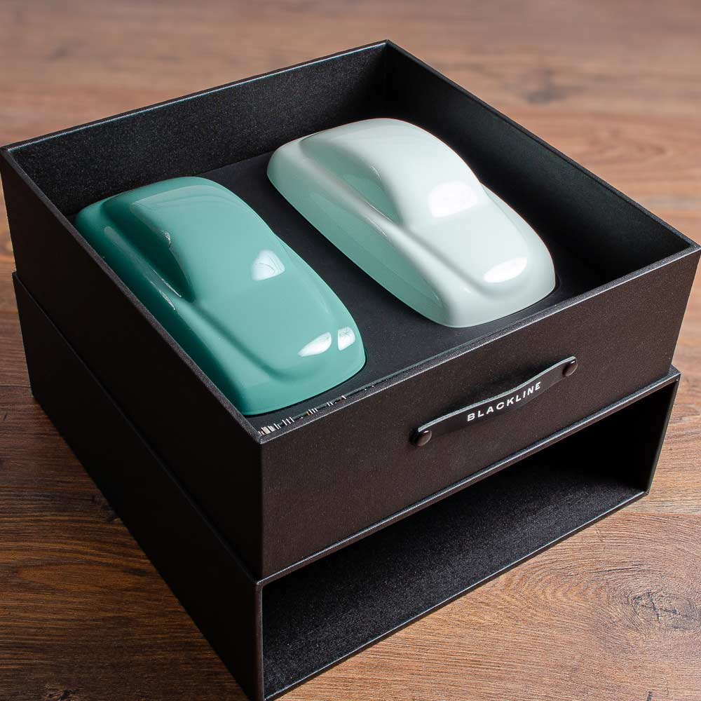 models of cars sitting on custom made black presentation box - Gallery image 2