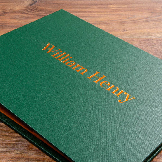 Green photography portfolio book with copper foil embossed logo