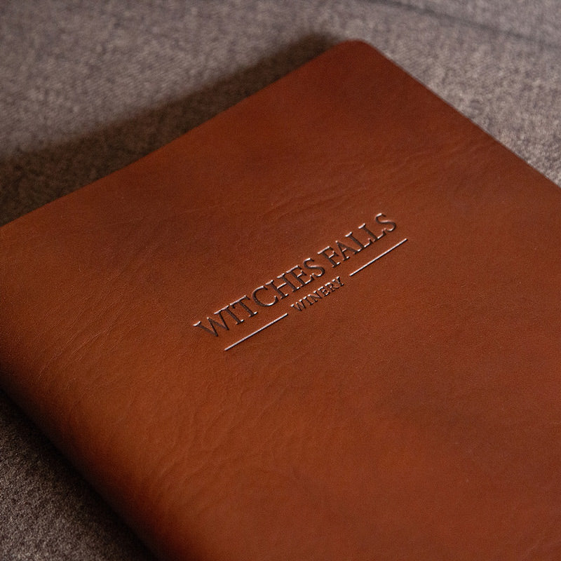 blind embossed logo on the cover of a leather menu cover - Gallery image 1