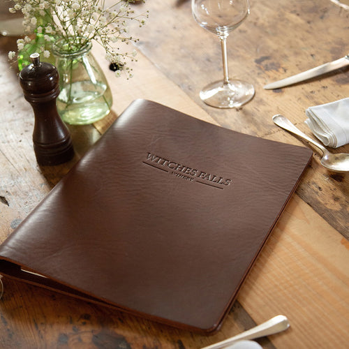 rustic leather menu cover with embossed personalised logo