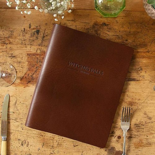 brown leather menu cover in thick leather with logo embossed on the cover