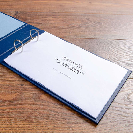landscape ring binder open with pages  inserted for logten pilot logbook
