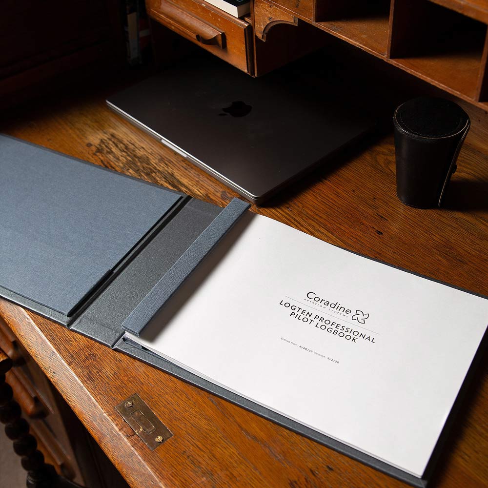 Coradine logten pilot logbook professional screw post binder sitting on antique wooden desk - Gallery image 5
