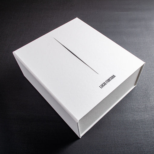 white clamshell box file with black cut out stripe and black foil embossed logo
