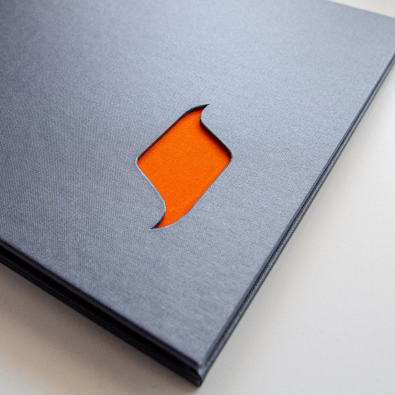 cut out window in grey binder with orange fabric back ground - Gallery image 2