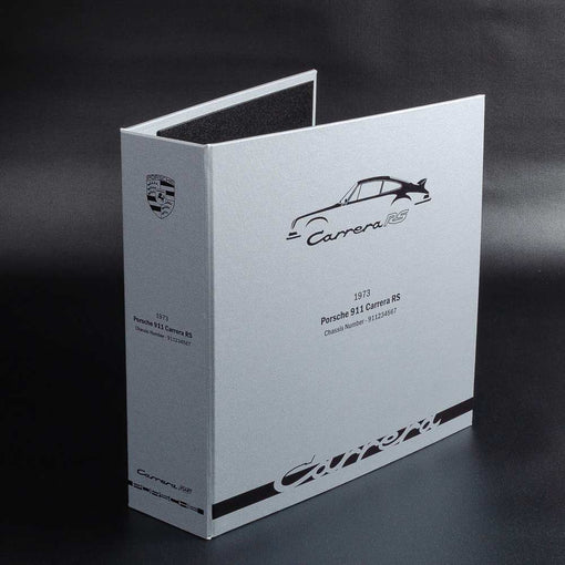 printed bespoke car history file in silver and black with titles and logos