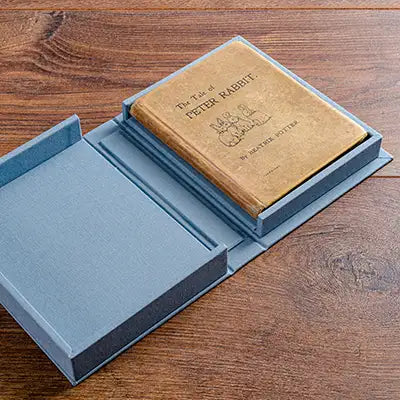beatrix potter peter rabbit book in blue clamshell solander box