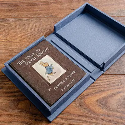 early edition beatrix potter book in custom made blue clamshell solander box