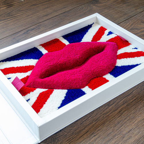 Presentation box for carpet company with union jack flag and large lips made out of carpet