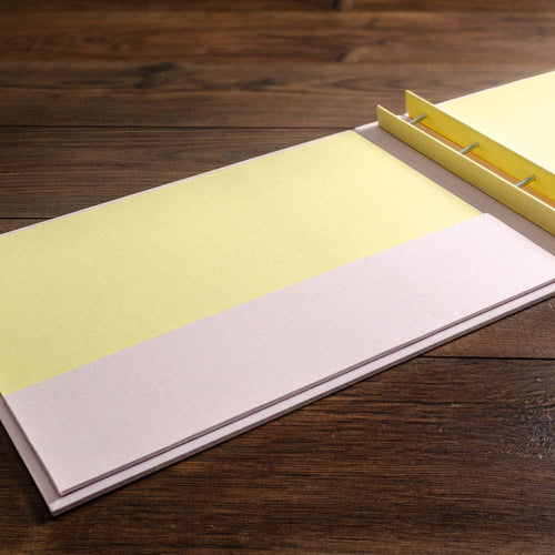 Inner cover of a screw post portfolio binder with inner pocket