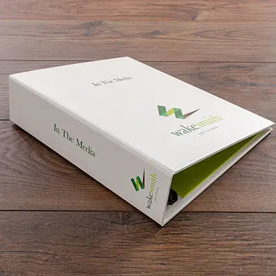 custom made ring binder for company press cuttings in white buckram with colour printed cover hand made by Hartnack and co