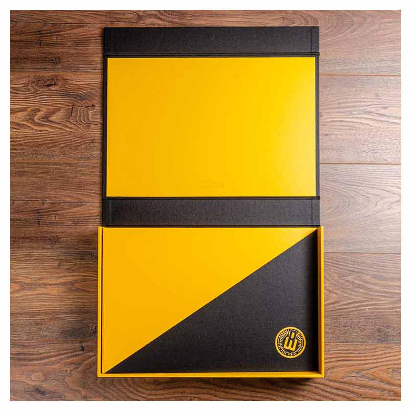 Portfolio book in yellow and black inside a cutom made portfolio clamshell box