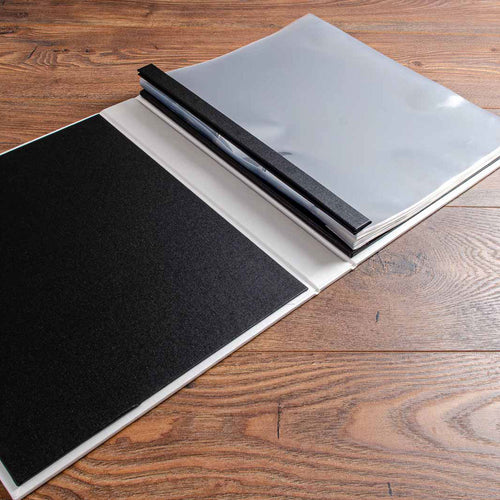 black and white screw post portfolio book with plastic pockets
