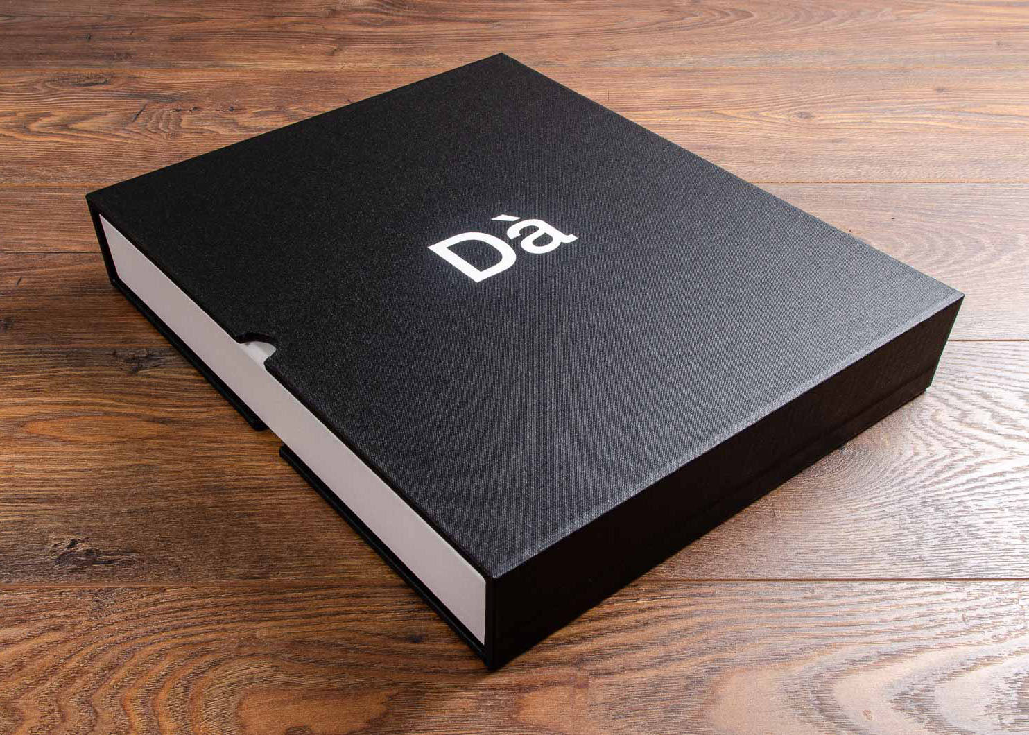 A4 Photography portfolio book and slipcase with white foil embossing and optional finger notches