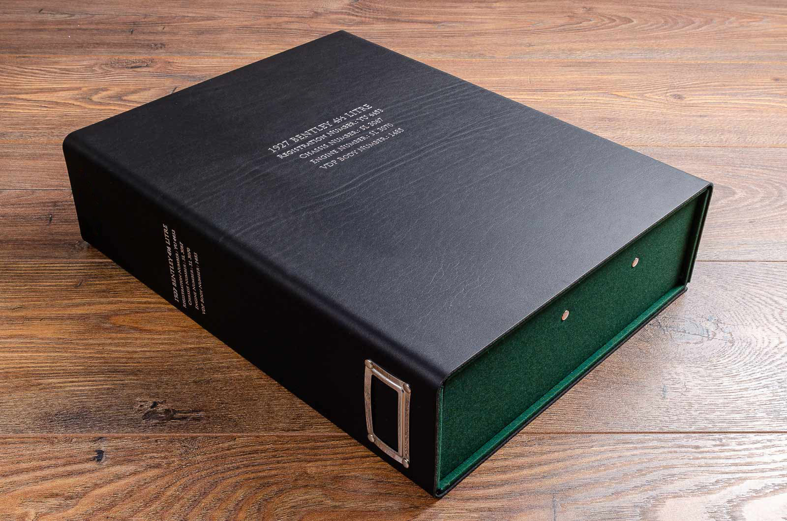 Customised black and green vehicle document box with silver foil embossment