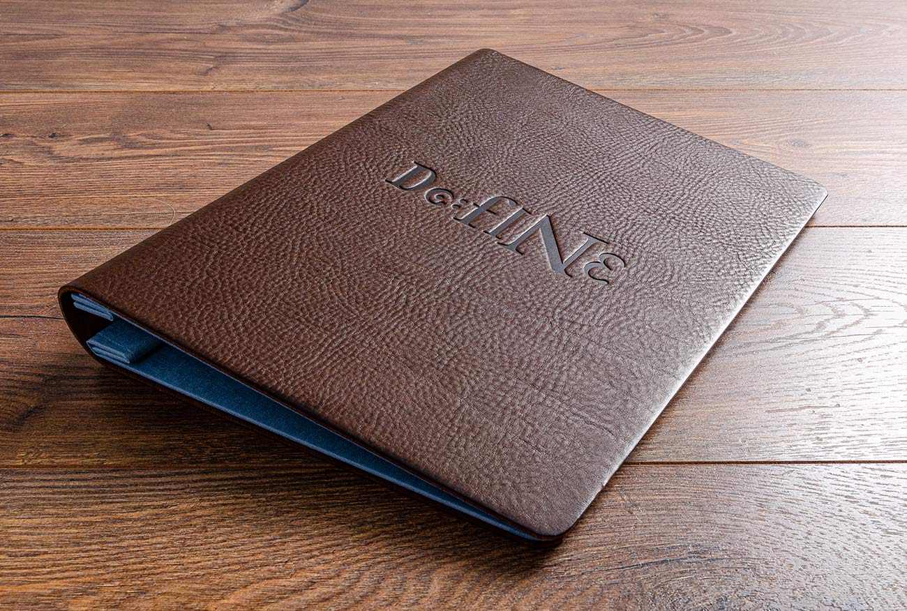 Personalised leather menu cover. Product is A4 leather screw post binder by Hartnack and Co