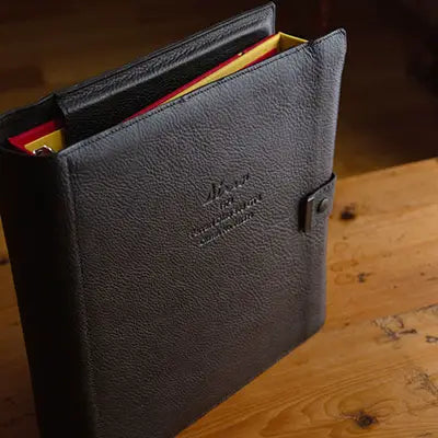 Custom made black leather luxury ring binder holder containing 2 ring binders with personalised cover by Hartnack & Co.