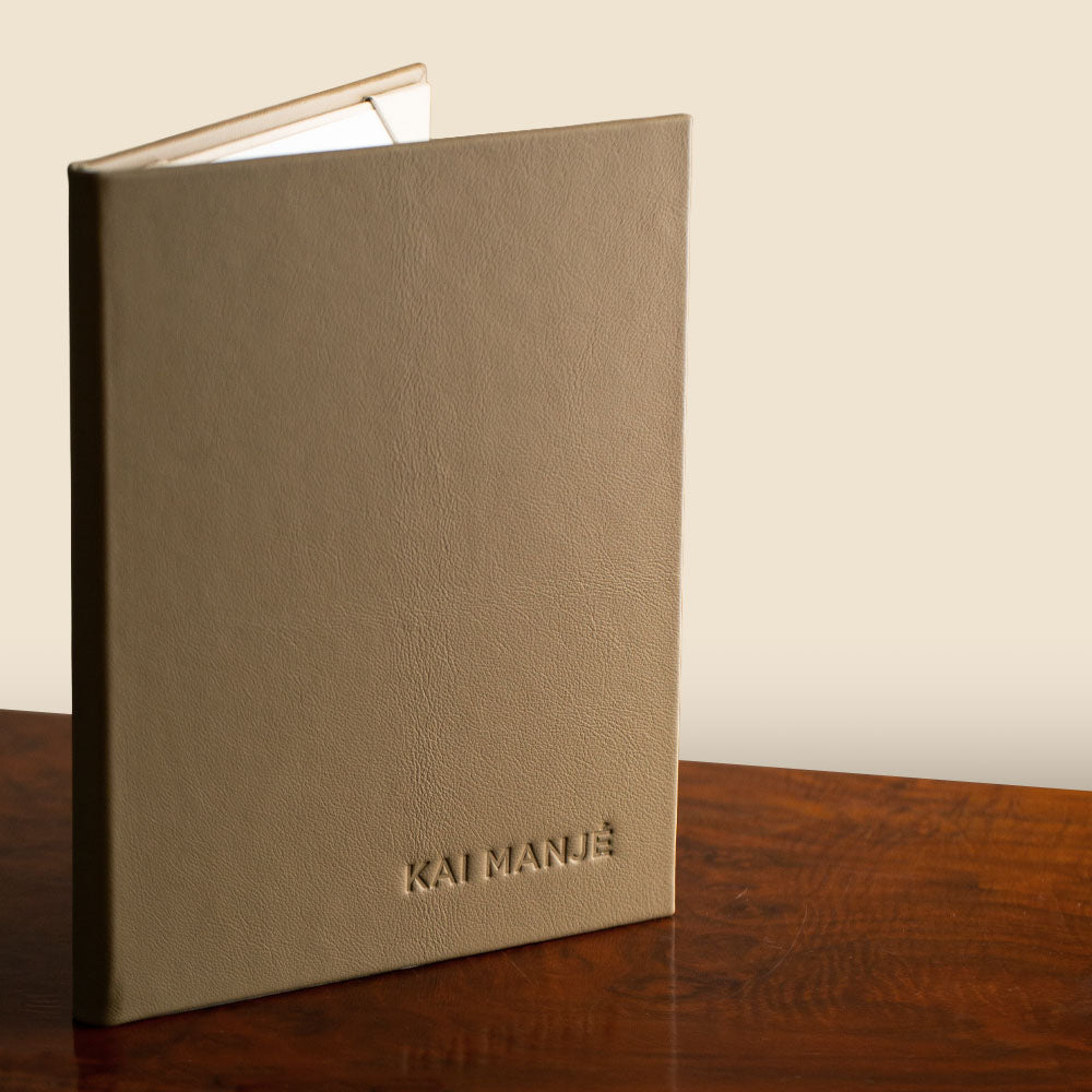 High end leather double page menu cover made by Hartnack & Co with a blind deboss personalisation
