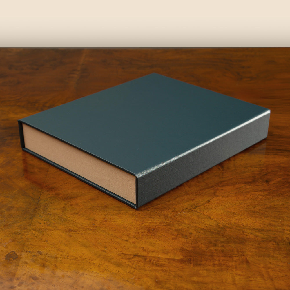 Custom made Box File in dark blue luxury finish, bespoke clamshell box binder by Hartnack and Company.