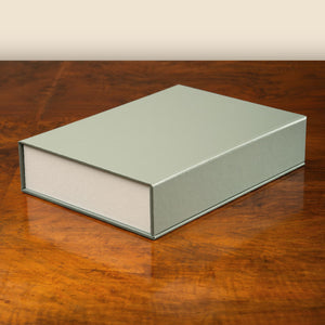 Drop Back Box luxury bespoke clamshell presentation box with magnetic closures, handcrafted by Hartnack and Company.
