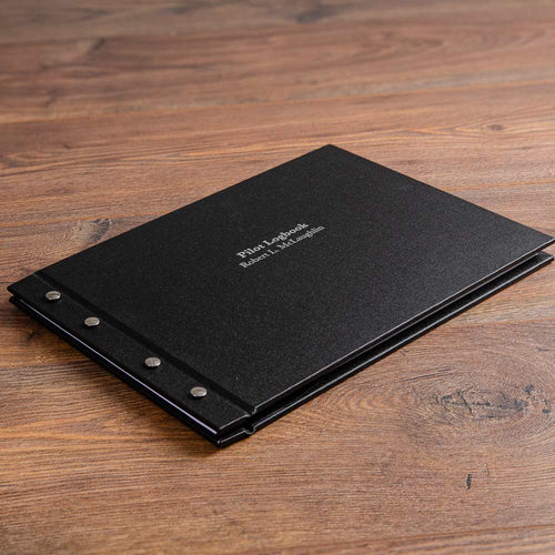black buckram cover of an exposed screw post binder for pilot logook with silver foil personalised cover