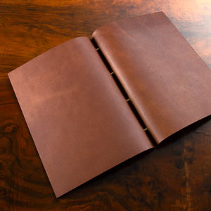 Leather Exposed Screw Post Binder in luxury veg tan leather, bespoke presentation binder for portfolios and documents.