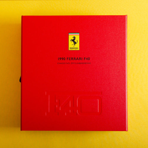 Custom made red box file with the writing 1990 Ferrari F40 on the cover and a embossed F40 logo