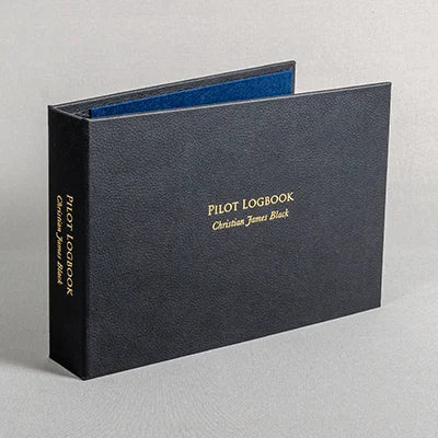 Black faux leather pilot logbook ring binder with gold foil personalisation on the cover and the spine