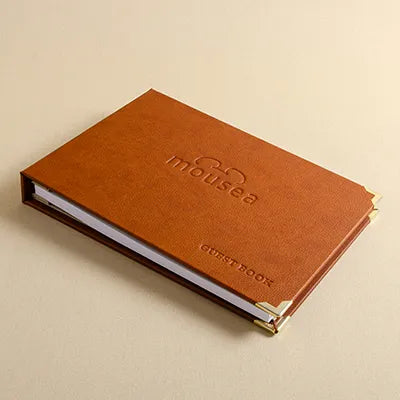 High quality faux or vegan leather personalised guest book with embossed logo and brass corner protectors
