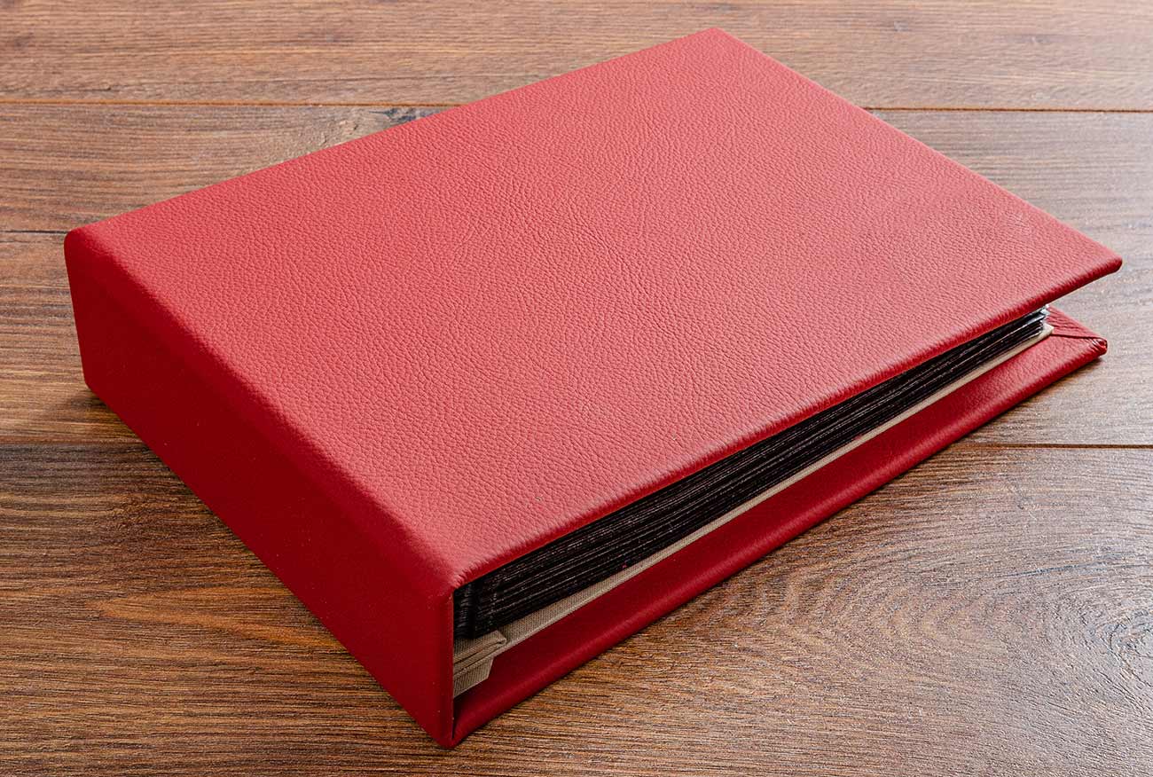 Vehicle document binder wrapped in red leather