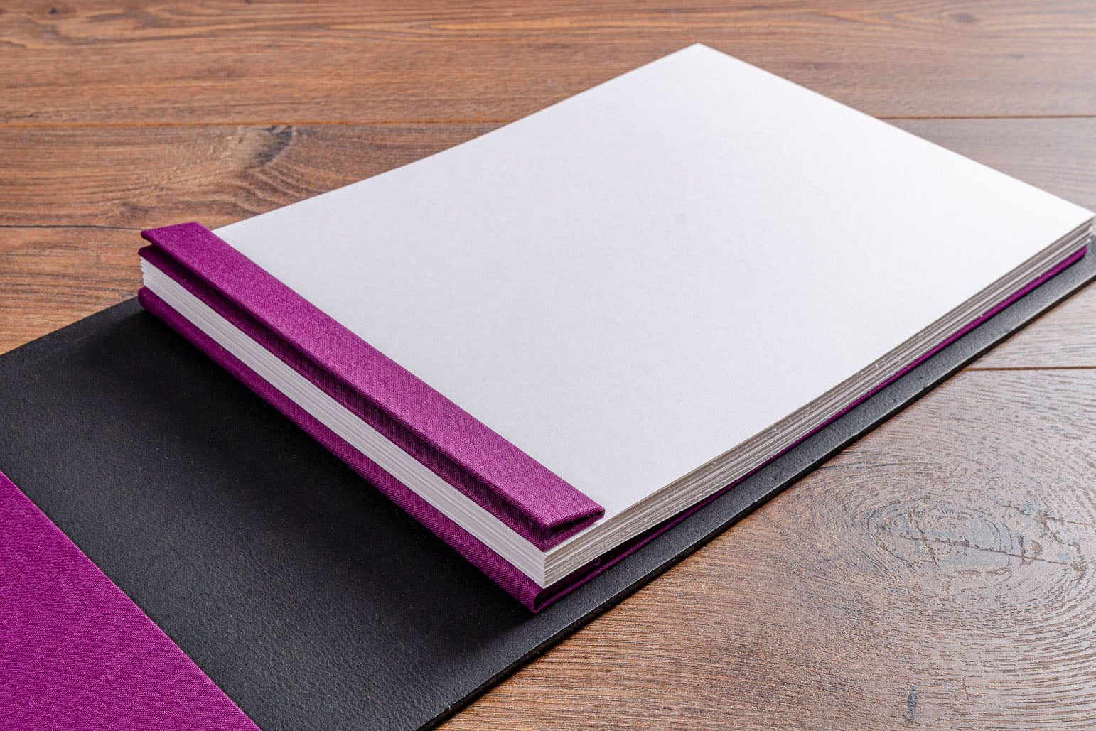 Screw post binding mechanism with white A4 landscape pages in leather guest book