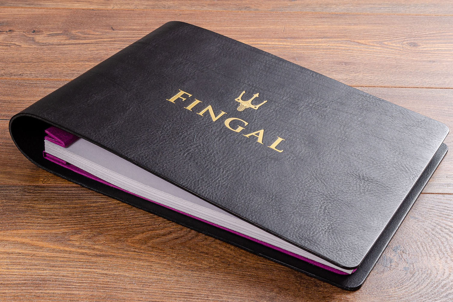 Personalised black leather guest book. Custom made gold foil embossing