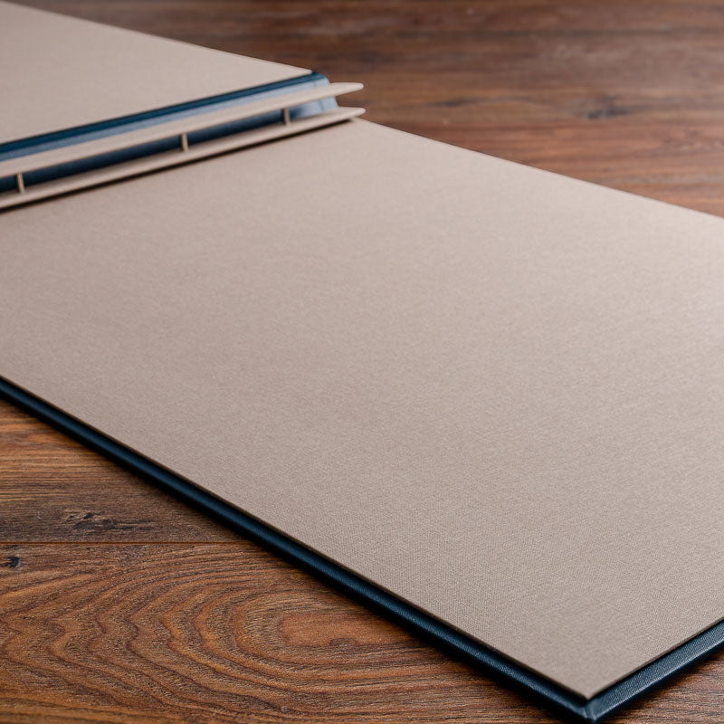 large screw post binder lying open with brown beige inner cover - Gallery image 1