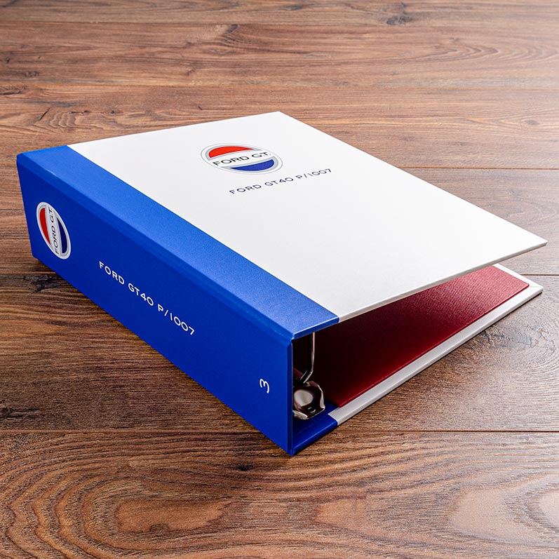 The spine for vehicle document binder is in a blue buckram to match the racing colours if the car and is also full colour printed with the logo and chassis number on the spine