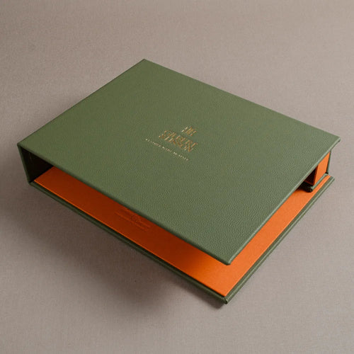 Green leather covered screw post swatch book with gold foil embossed cover